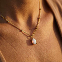 Thumbnail for Opal Pendant Necklace by Brother & Sisters, featuring AAA-grade opal in gold prongs on a delicate satellite chain.