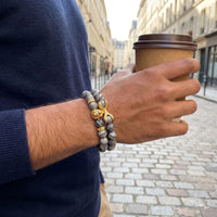 Thumbnail for Gold Lion & Grey Stones Set – held in a man's hand | Brother & Sisters | SKU: 21039839SET-gold-XS-14-15, 21039839SET-gold-S-16-17, 21039839SET-gold-M-18-19, 21039839SET-gold-L-20-21, 21039839SET-gold-XL-22-23